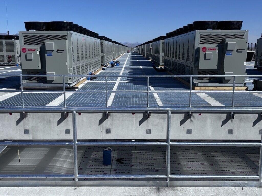 Rows of rooftop chillers with access walkway